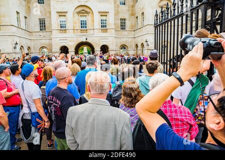 People watching Changing of the guard at Horse guards parade, Household Cavalry. London, England, United Kingdom, Europe