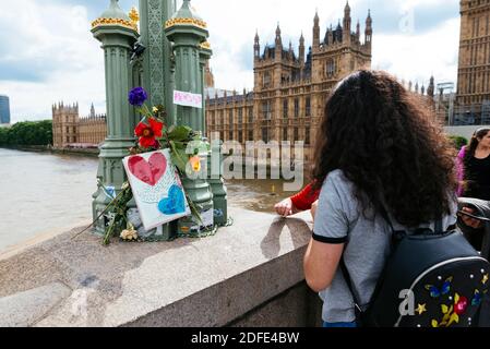 Floral tributes are laid out in Westminster Bridge in remembrance of the victims of the terror attack on 22nd March 2017. London, England, United King
