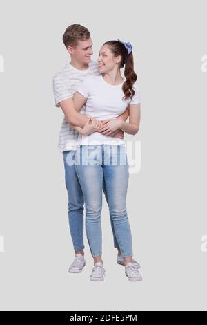 Couple Standing Hugging Looking at Each Other Isolated. Man and Woman Hugging, Lovers, Friends, Couple Concept Stock Photo