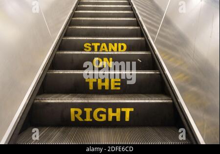 Stand on the right sign on escalator stairs on the London Underground. London Stock Photo