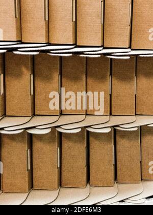 Close up of empty folded cardboard boxes. Background from cardboard boxes. Stock Photo