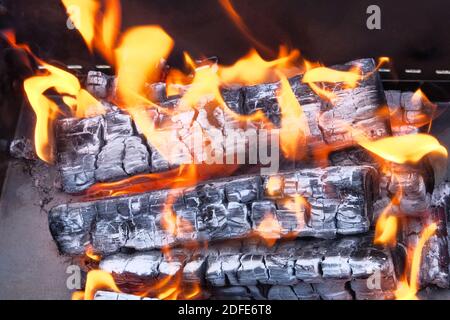 Macro texture flame from burning logs in fireplace. Wood fire prepared for barbecue. Stock Photo