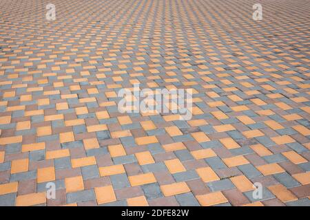 A colorful tiled pavement texture in a park Stock Photo