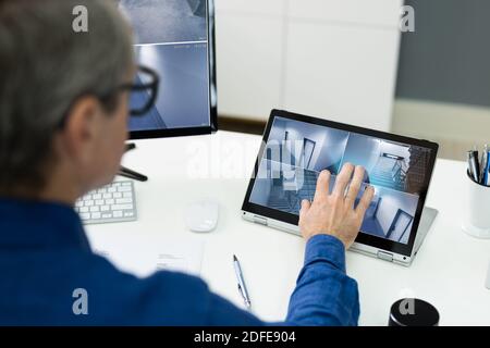 CCTV Security System Security Footage On Office Laptop Stock Photo