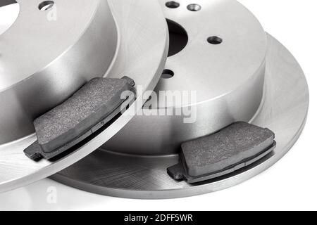 set of brake pad and brake disc new car spare parts brakes for a vehicle close up isolated on a white background close up view, nobody. Stock Photo