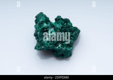 Malachite green ore on a white background. Natural green malachite Stock Photo