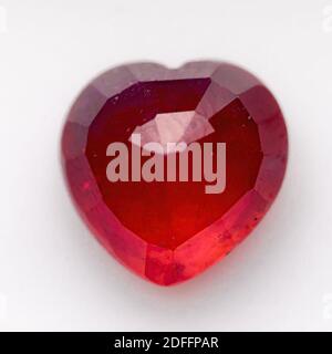 Natural ruby in the shape of a heart on a white background Stock Photo