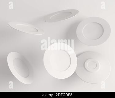 Flying clean plates on white background Stock Photo - Alamy