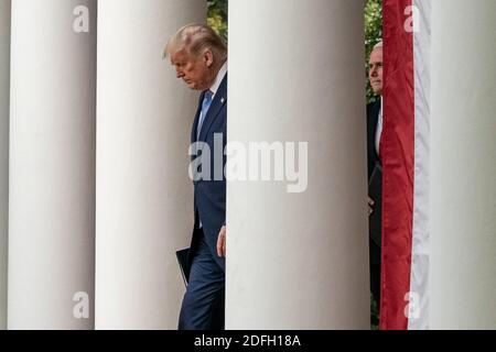 United States President Donald Trump walks out to the Rose Garden with Vice President Mike Pence to give an update on the Nation's Coronavirus Testing Strategy in the Rose Garden of the White House September 28, 2020 in Washington, DC, USA. Photo by Ken Cedeno/Pool/ABACAPRESS.COM Stock Photo