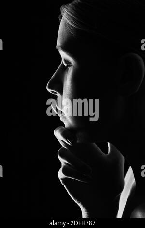 sad woman profile on black background, monochrome Stock Photo - Alamy