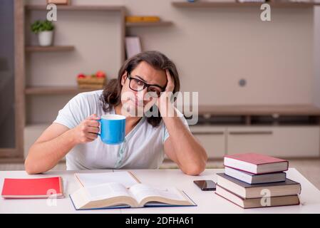 Young student preparing for exams at home Stock Photo
