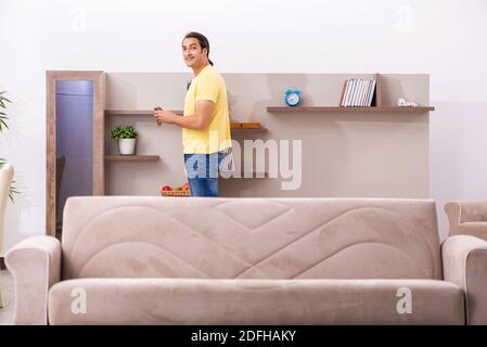 Young student boring at home during pandemic Stock Photo
