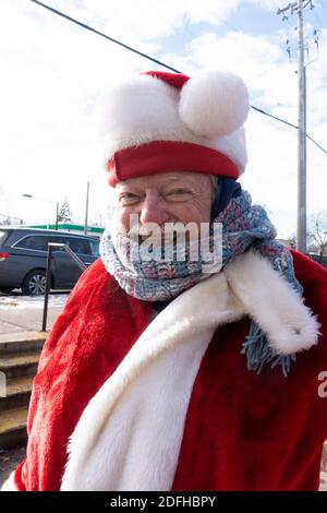 Close up of Santa Claus volunteer collecting funds for the Salvation Army at the Walgreens store. St Paul Minnesota MN USA Stock Photo