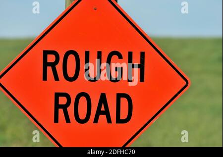 A road sign warning motorists that there is a bumpy road ahead in rural Alberta Canada Stock Photo