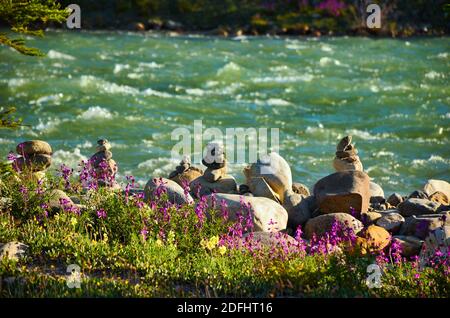 Rocky Mountains. Beautiful landscape with cairn, flowers, mountains and rivers in the Jasper National Park Canada. Icefield parkway. Travel in BC Stock Photo