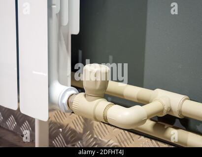 Connecting a heating radiator in a one-pipe system Stock Photo