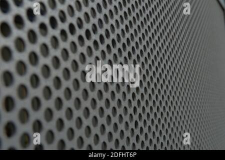 White metal plate with many small circular holes Stock Photo
