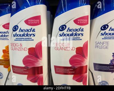 Viersen, Germany - May 9. 2020: Closeup of bottles Head and Shoulders shampoo in shelf of german supermarket