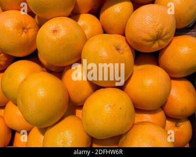 Close up of isolated group ripe raw yellow grapefruits on german market Stock Photo