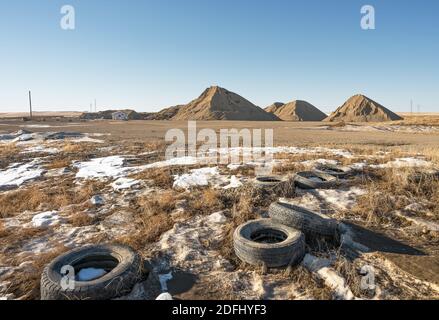 Gravel pit and old tires near the town of Beiseker, Alberta, Canada Stock Photo