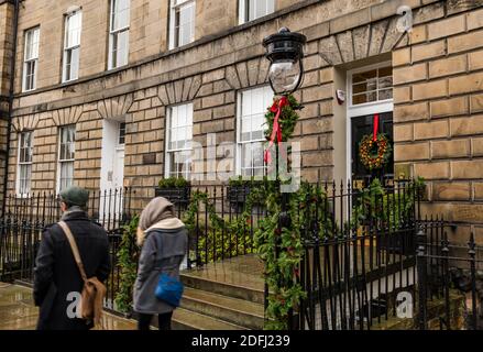 Edinburgh, Scotland, United Kingdom, 5th December 2020. A decorative seasonal festive Christmas wreath on a front door of a Georgian townhouse in the New Town Stock Photo