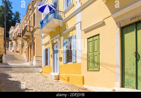 Colourful houses along the Kali Strata in the old hillside Horio, Symi Island, Dodecanese, Greece Stock Photo