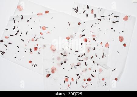 Abstract art background. Red and black stains on soft white paper. Great design for any purposes. Stock Photo