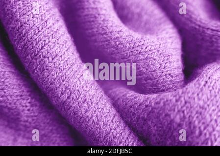 Close up of purple knitted textured background. Trendy color. Stock Photo