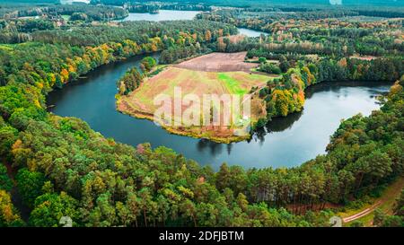 Big winding river and autumn forest in Poland, aerial view Stock Photo