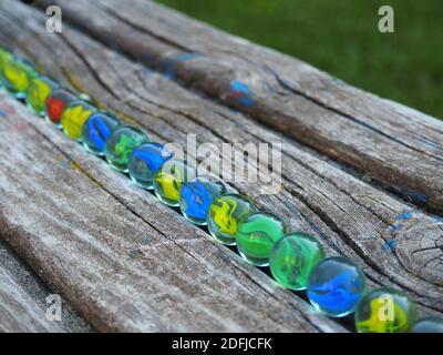 Colored glass balls on an old wooden climber on a playground in Budapest suburb, Hungary Stock Photo