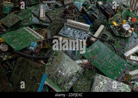 Scrap yard printed circuit board electronic waste for recycling with selective focus. main board electronic waste Stock Photo