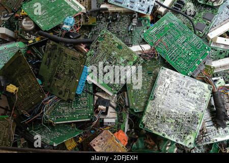 Scrap yard printed circuit board electronic waste for recycling with selective focus. main board electronic waste Stock Photo