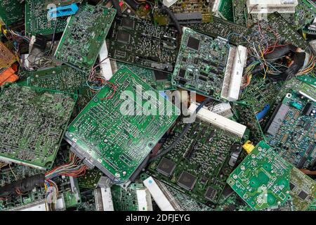 Scrap yard printed circuit board electronic waste for recycling with selective focus. main board electronic waste Stock Photo