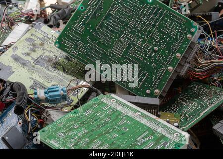 Scrap yard printed circuit board electronic waste for recycling with selective focus. main board electronic waste Stock Photo