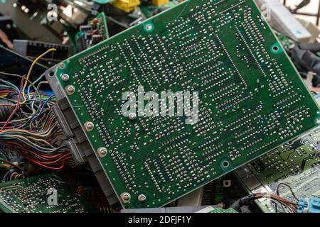 Scrap yard printed circuit board electronic waste for recycling with selective focus. main board electronic waste Stock Photo