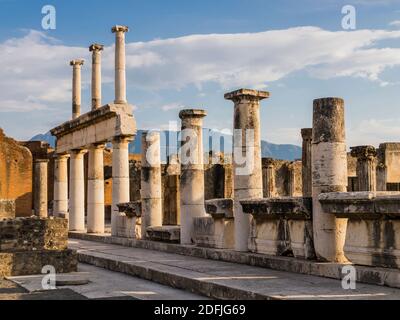 Evocative ruins of the ancient city of Pompeii with columns and capitals, Naples, Italy Stock Photo
