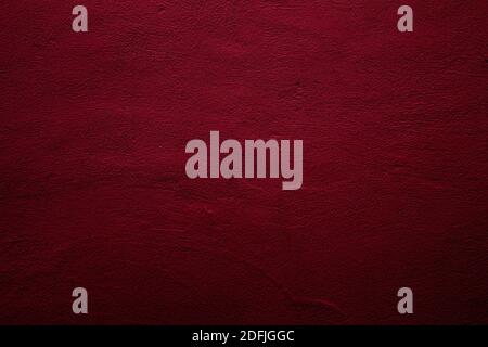 Crimson colored wall background with textures of different shades of red Stock Photo