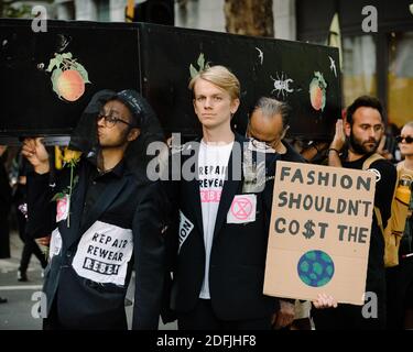 London, United Kingdom - September 17, 2019: Extinction Rebellion outside London Fashion Week to raise awareness on the climate impact of fashion Stock Photo