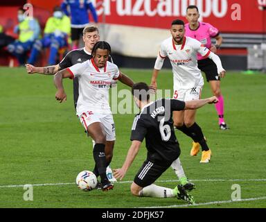 SEVILLA, 05-12-2020. Primera Division Spanish League. LaLiga. Ramón Sánchez-Pizjuán Stadium. Jules Koundé (Sevilla FC) and Toni Kroos and Nacho Fernández (Real Madrid) during the game Sevilla FC - Real Madrid. Photo: Juan Jose Ubeda/PROSHOTS. Stock Photo