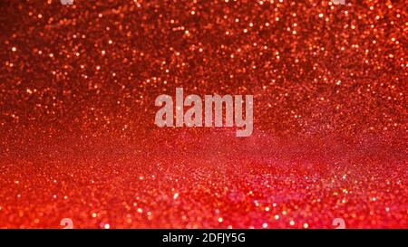 Red glittered fabric close up with selective focus Texture and background Stock Photo