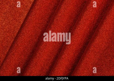 Red glittered velvet close up. Texture and background Stock Photo