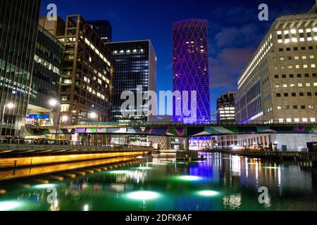 5 December 2020 - London, UK, View over Middle Dock in Canary Wharf, Connected by Light curated light art installations on display, Ghost Trees by Tom Wilkinson Stock Photo