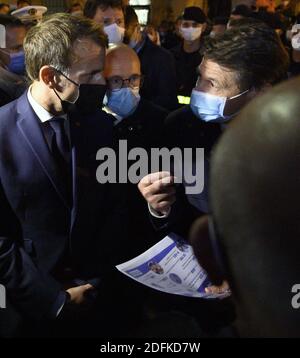 French President Emmanuel Macron with Eric Ciotti and Christian Estrosi in Saint-Martin-Vesubie on October 8, 2020, during a visit in the Alpes-Maritimes departement where storms and extensive flooding caused widespread damage. Intense flooding hammered southeast France over the weekend of October 2, causing four confirmed deaths in France and two in Italy, with the toll expected to rise further as searches continue for survivors. Hundreds of people have been evacuated after storms dumped huge amounts of rain that turned streams into churning torrents that swept away cars, houses and bridges i Stock Photo