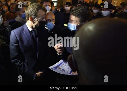 French President Emmanuel Macron with Eric Ciotti and Christian Estrosi in Saint-Martin-Vesubie on October 8, 2020, during a visit in the Alpes-Maritimes departement where storms and extensive flooding caused widespread damage. Intense flooding hammered southeast France over the weekend of October 2, causing four confirmed deaths in France and two in Italy, with the toll expected to rise further as searches continue for survivors. Hundreds of people have been evacuated after storms dumped huge amounts of rain that turned streams into churning torrents that swept away cars, houses and bridges i Stock Photo