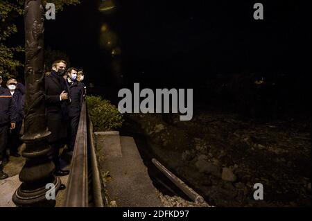 French President Emmanuel Macron with Eric Ciotti and Christian Estrosi in Saint-Martin-Vesubie on October 8, 2020, during a visit in the Alpes-Maritimes departement where storms and extensive flooding caused widespread damage. Intense flooding hammered southeast France over the weekend of October 2, causing four confirmed deaths in France and two in Italy, with the toll expected to rise further as searches continue for survivors. Hundreds of people have been evacuated after storms dumped huge amounts of rain that turned streams into churning torrents that swept away cars, houses and bridges i Stock Photo