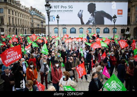 General view of Protesters hold liberty equality parternity flags during a protest called by pro-life conservative activist group 'La Manif Pour Tous'against the bioethics bill on Medically Assisted Reproduction (PMA - Procreation Medicalement Assistee), in Paris, France, on October 10, 2020. Voted on August 1 in the second reading at the National Assembly, the bill, whose flagship measure is the opening of medically assisted procreation to all women, is due to be examined by the Senate on a date not yet set, towards the end of the year or early 2021. Photo by Raphael Lafargue/ABACAPRESS.COM Stock Photo