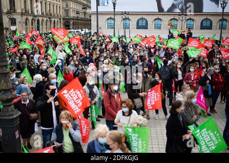 General view of Protesters hold liberty equality parternity flags during a protest called by pro-life conservative activist group 'La Manif Pour Tous'against the bioethics bill on Medically Assisted Reproduction (PMA - Procreation Medicalement Assistee), in Paris, France, on October 10, 2020. Voted on August 1 in the second reading at the National Assembly, the bill, whose flagship measure is the opening of medically assisted procreation to all women, is due to be examined by the Senate on a date not yet set, towards the end of the year or early 2021. Photo by Raphael Lafargue/ABACAPRESS.COM Stock Photo