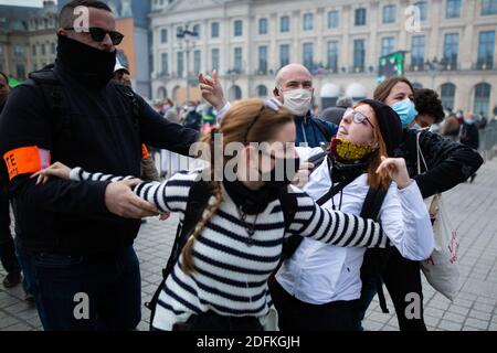 Counter protesters supporting the bioethics bill kicked out by security during a protest called by pro-life conservative activist group 'La Manif Pour Tous'against the bioethics bill on Medically Assisted Reproduction (PMA - Procreation Medicalement Assistee), in Paris, France, on October 10, 2020. Voted on August 1 in the second reading at the National Assembly, the bill, whose flagship measure is the opening of medically assisted procreation to all women, is due to be examined by the Senate on a date not yet set, towards the end of the year or early 2021. Photo by Raphael Lafargue/ABACAPRESS Stock Photo