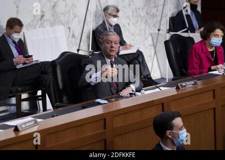 Committee Chairman Senator Lindsey Graham (R-SC) asks Judge Amy Coney Barrett, who has been nominated by US President Donald Trump to fill Ruth Bader Ginsburg's seat on the US Supreme Court, questions during her confirmation hearing before the Senate Judiciary Committee confirmation hearing on Capitol Hill October 13, 2020, in Washington, DC. Photo by Brendan Smialowski/Pool/ABACAPRESS.COM Stock Photo