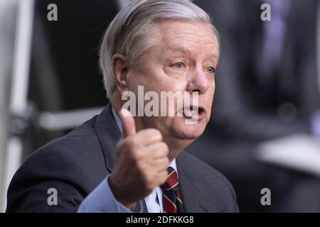 Committee Chairman Senator Lindsey Graham (R-SC) asks Judge Amy Coney Barrett, who has been nominated by US President Donald Trump to fill Ruth Bader Ginsburg's seat on the US Supreme Court, questions during her confirmation hearing before the Senate Judiciary Committee confirmation hearing on Capitol Hill October 13, 2020, in Washington, DC. Photo by Brendan Smialowski/Pool/ABACAPRESS.COM Stock Photo